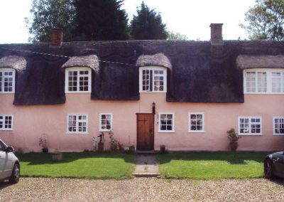 Thatched & rendered listed property decoration